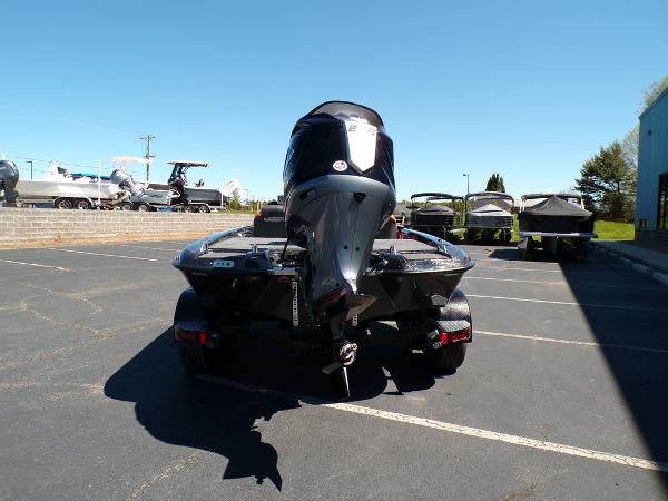 Slide: The Image of 2024 Phoenix 919 Pro XP boat rear view in parking lot. - 4