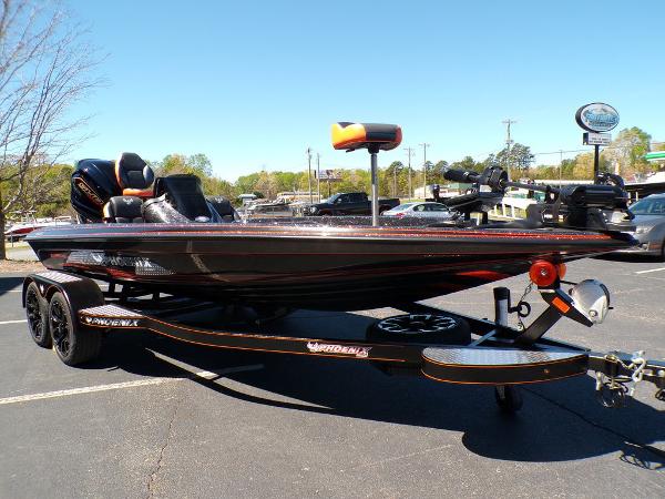 Slide: The Image of 2024 Phoenix 919 Pro XP bass boat in parking lot. - 8