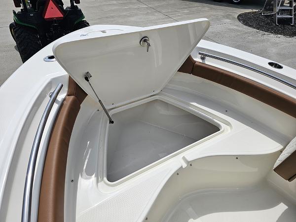 Slide: The Image of 2025 Pioneer 202 Islander boat with open storage compartment on deck. - 20