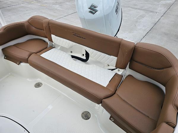 Slide: The Image of 2025 Pioneer 202 Islander boat seating with brown and white upholstery. - 9