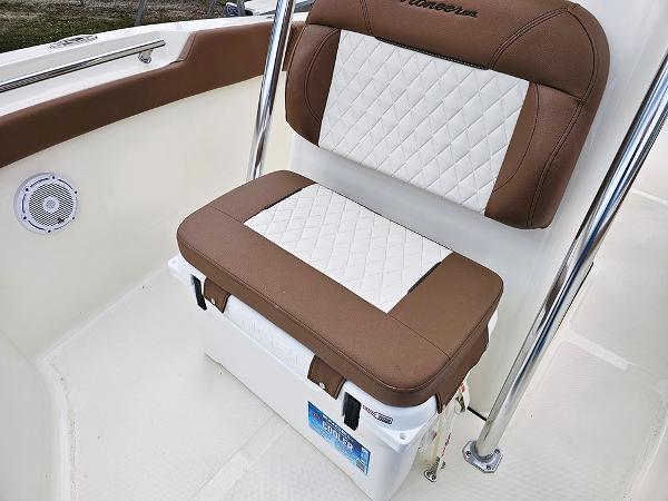 Slide: The Image of 2025 Pioneer 202 Sportfish boat seat with brown and white cushioned design. - 19