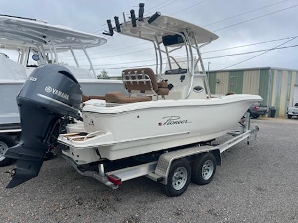 Slide: The Image of 2024 Pioneer 222 Islander boat on trailer with Yamaha outboard motor. - 1