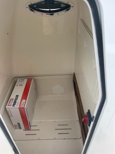 Slide: The Image of 2024 Pioneer 222 Islander storage compartment with a Yamaha propeller box. - 7