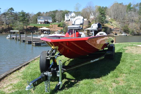 Slide: The Image of 2022 Polar Kraft Bass TX 195 Pro boat on trailer by lakeside. - 3