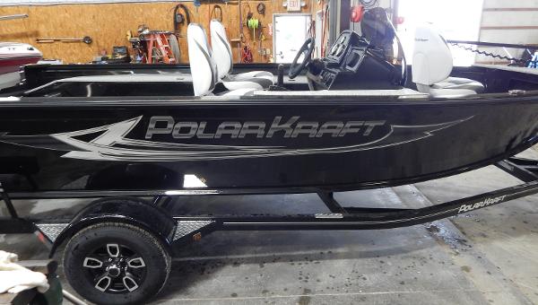 Slide: The Image of 2024 Polar Kraft Outlander 186 SC boat in a garage. - 1