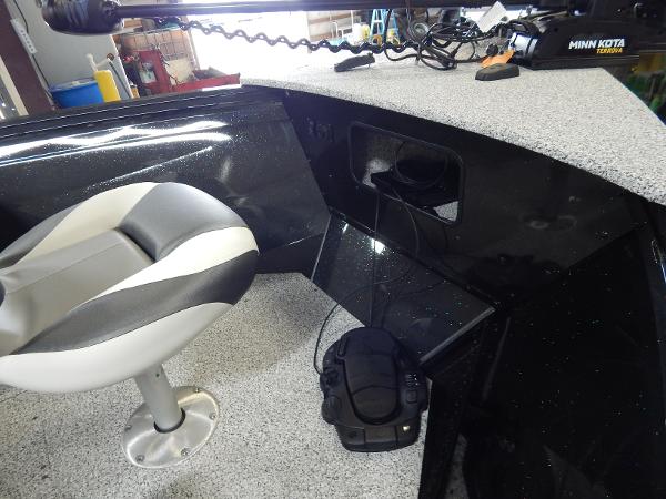 Slide: The Image of 2024 Polar Kraft Outlander 186 SC boat interior with seat and Minn Kota trolling motor. - 2