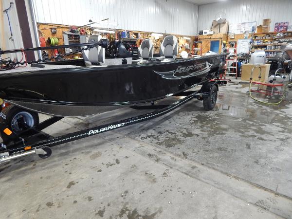 Slide: The Image of 2024 Polar Kraft Outlander 186 SC boat in a workshop. - 3