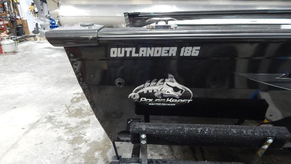 Slide: The Image of 2024 Polar Kraft Outlander 186 SC boat rear view in a workshop. - 33