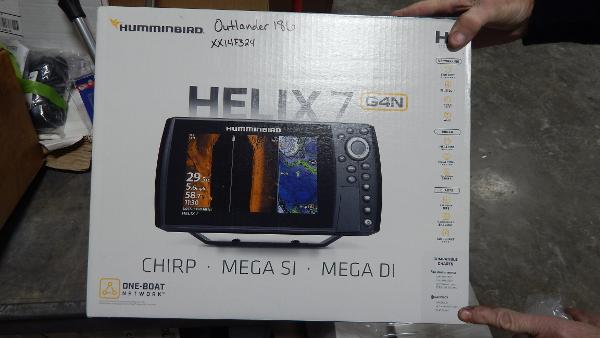 Slide: The Image of Humminbird Helix 7 G4N fish finder box held by hands, labeled for Polar Kraft Outlander 186 SC 2024 - 35