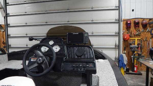 Slide: The Image of 2024 Polar Kraft Outlander 186 SC boat dashboard in a garage. - 37