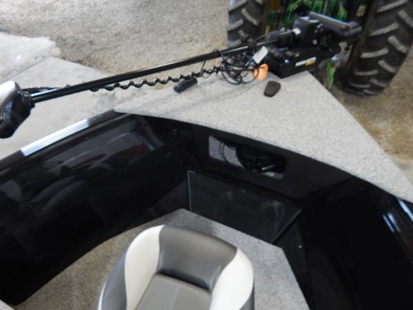 Slide: The Image of 2024 Polar Kraft Outlander 186 SC boat interior with trolling motor and seating. - 38
