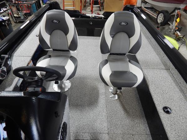 Slide: The Image of 2024 Polar Kraft Outlander 186 SC boat interior with two seats and steering console. - 39
