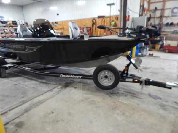 Slide: The Image of 2024 Polar Kraft Outlander 186 SC boat on trailer in a workshop. - 4