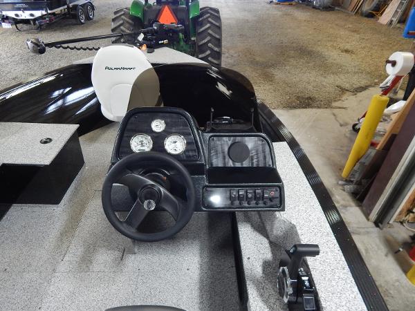 Slide: The Image of 2024 Polar Kraft Outlander 186 SC boat dashboard and steering wheel in a garage. - 41