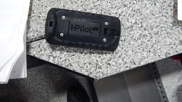 Slide: The Image of iPilot remote on a granite countertop, Polar Kraft Outlander 186 SC, 2024 model. - 7