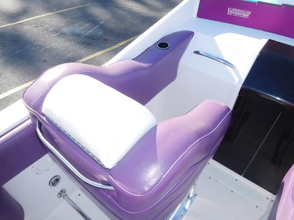 Slide: The Image of 1997 Powerplay Powerboats 28 Sport Deck with purple and white seating. - 18