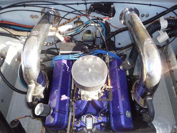 Slide: The Image of 1997 Powerplay Powerboats 28 Sport Deck engine with purple components and chrome exhaust pipes. - 26
