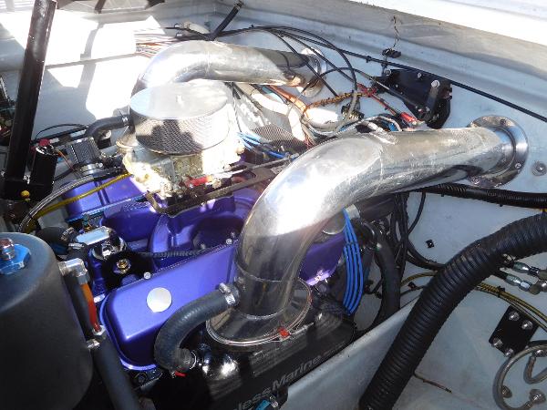 Slide: The Image of Engine compartment of a 1997 Powerplay Powerboats 28 Sport Deck with visible components. - 27