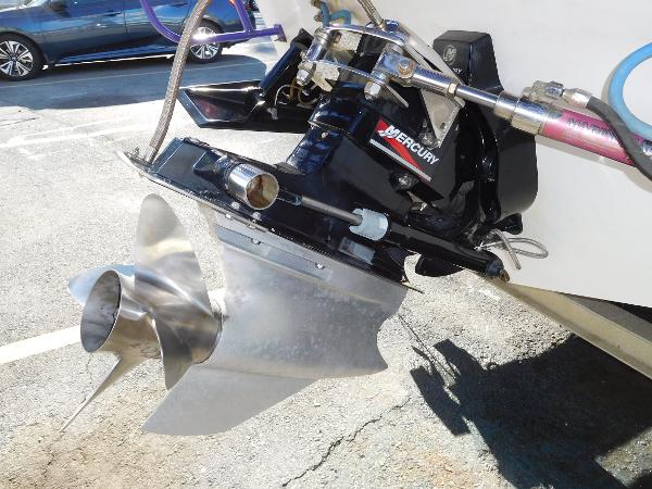 Slide: The Image of Close-up of a 1997 Powerplay Powerboats 28 Sport Deck propeller and Mercury engine. - 31