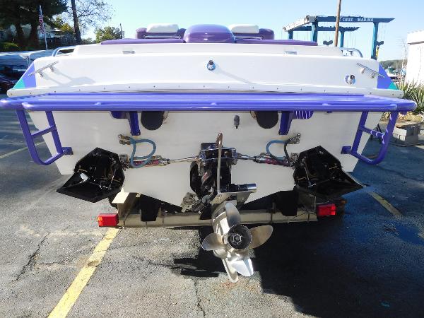 Slide: The Image of 1997 Powerplay Powerboats 28 Sport Deck, rear view with dual propellers. - 5