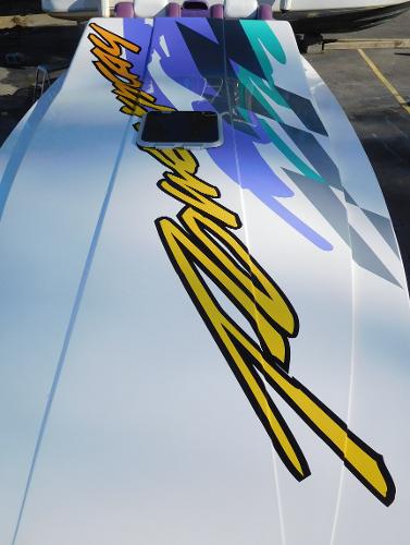 Slide: The Image of 1997 Powerplay Powerboats 28 Sport Deck with vibrant graphics and sleek design. - 6