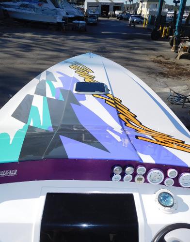 Slide: The Image of 1997 Powerplay Powerboats 28 Sport Deck with vibrant graphics and sleek design. - 7