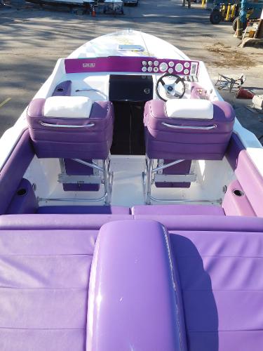 Slide: The Image of 1997 Powerplay Powerboats 28 Sport Deck with purple interior and dual seating. - 8
