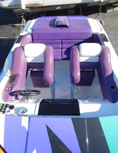 Slide: The Image of 1997 Powerplay Powerboats 28 Sport Deck with purple and white seating. - 9