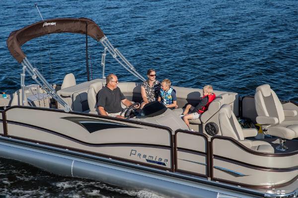 Slide: The Image of 2023 Premier 220 Castaway pontoon boat with family cruising on the water. - 1