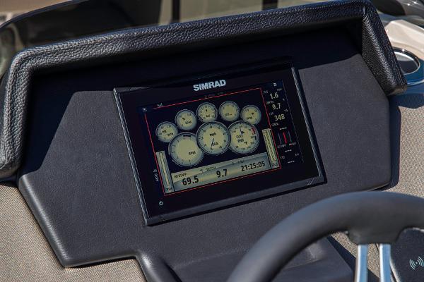 Slide: The Image of 2023 Premier 220 Castaway boat dashboard with Simrad display. - 12
