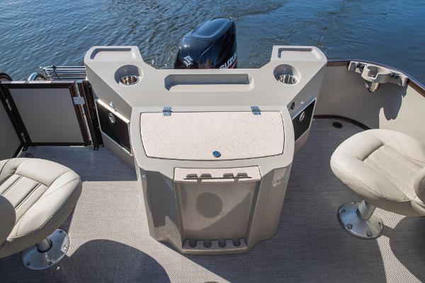 Slide: The Image of 2023 Premier 220 Castaway boat interior with seating and storage compartments. - 15