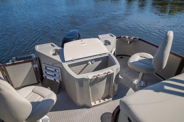 Slide: The Image of 2023 Premier 220 Castaway boat interior with seating and storage. - 16