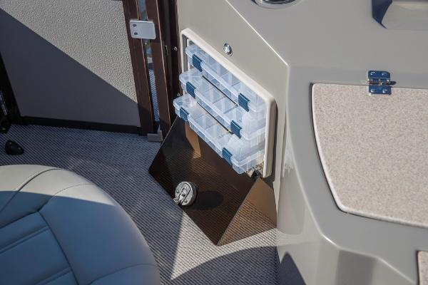 Slide: The Image of 2023 Premier 220 Castaway boat interior storage compartments and seating. - 17