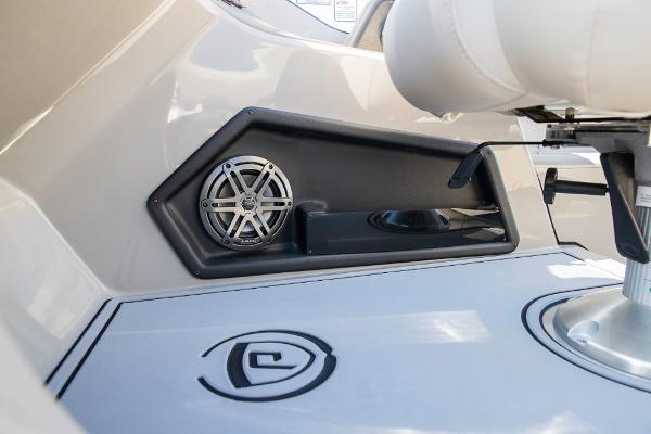 Slide: The Image of 2023 Premier 220 Castaway boat interior with speaker and seating. - 30