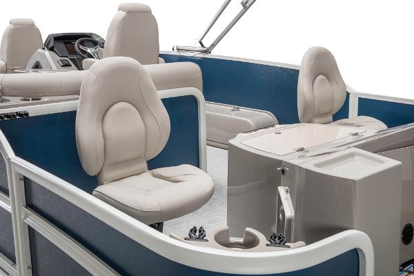 Slide: The Image of 2023 Premier 220 Castaway boat interior with plush seating and modern console. - 32