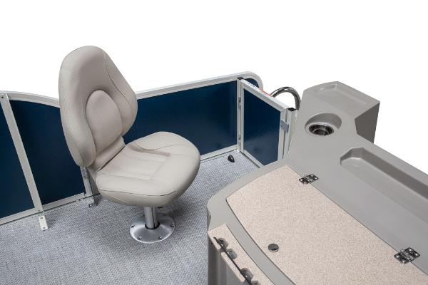 Slide: The Image of 2023 Premier 220 Castaway boat interior with beige captain's chair and console. - 34
