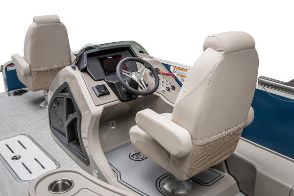Slide: The Image of 2023 Premier 220 Castaway boat interior with steering console and seating. - 36
