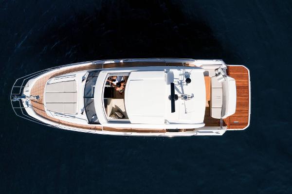 Slide: The Image of Aerial view of 2025 Prestige 420S yacht on calm water. - 2