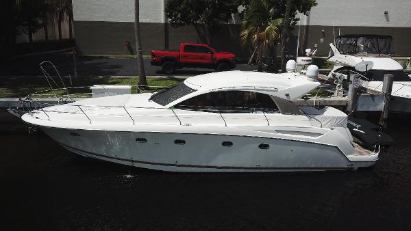 Slide: The Image of 2013 Prestige 440 S yacht docked in marina, side view. - 0