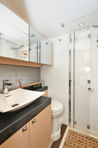 Slide: The Image of Modern bathroom in 2015 Prestige 500 Fly yacht with sleek fixtures and ample storage. - 12