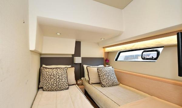 Slide: The Image of 2015 Prestige 500 Fly yacht twin bed cabin interior with modern decor and window view. - 13