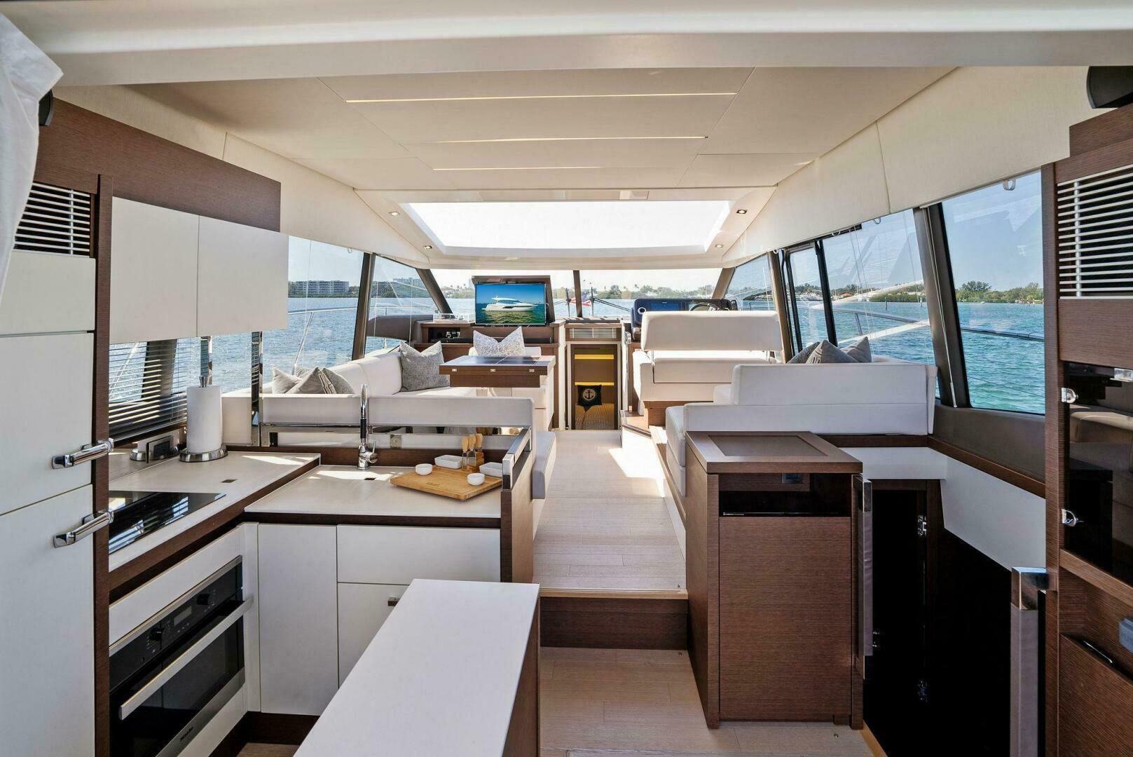 Slide: The Image of 2018 52 Prestige S - The Islanders - Salon/ Galley Overview - 4764095