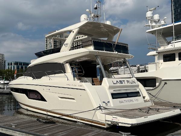 Slide: The Image of Luxurious 2017 Prestige 63 yacht docked, featuring sleek design and modern amenities. - 0