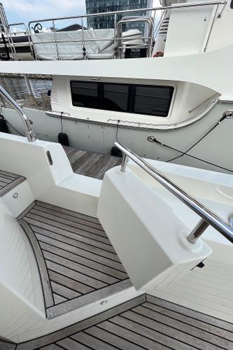 Slide: The Image of Prestige 63 yacht, 2017 model, featuring sleek deck design and modern railings. - 11