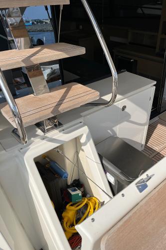 Slide: The Image of Staircase and storage compartment on a 2017 Prestige 63 yacht deck. - 15
