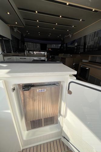 Slide: The Image of Interior of a 2017 Prestige 63 yacht with modern kitchen amenities. - 16