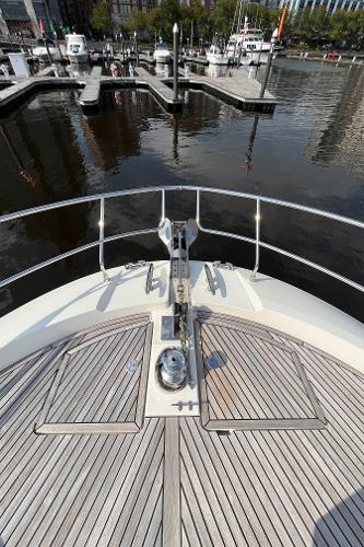 Slide: The Image of Bow view of 2017 Prestige 63 yacht docked at a marina. - 18