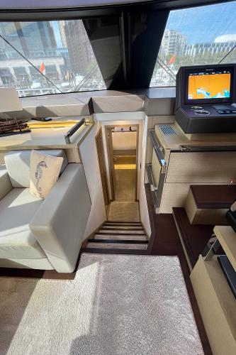 Slide: The Image of Interior of 2017 Prestige 63 yacht with modern seating and navigation equipment. - 19