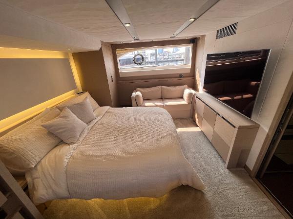 Slide: The Image of Luxurious bedroom interior of a 2017 Prestige 63 yacht with modern furnishings. - 29