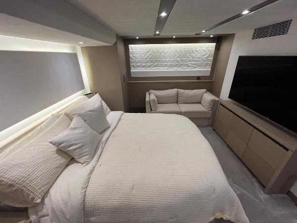 Slide: The Image of Luxurious bedroom interior on a 2017 Prestige 63 yacht, featuring a cozy bed and modern decor. - 33
